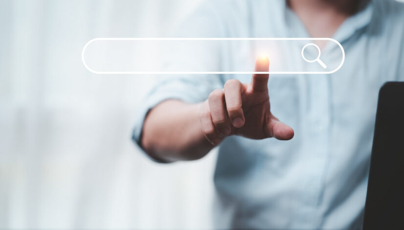 Hand touching with search icon for Search Engine Optimisation or